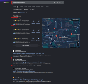 A screenshot of a Google SERP for the local query "columbus marketing agency," showing a Map Pack alongside organic results where the agency The Media Captain ranks prominently in both features.