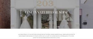 A webpage header displaying a white storefront with large glass windows showcasing bridal gowns, featuring overlay text that reads "CINCINNATI BRIDAL SHOP" and a "BOOK NOW" button.