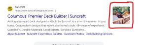 A Google Search ad for Suncraft titled "Columbus' Premier Deck Builder | Suncraft," with a red outline highlighting a custom image extension of a wooden backyard deck.